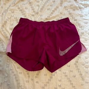 Nike magenta running shorts
